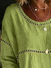 Light green bohemian t-shirt with openwork floral detail at neckline and waist
