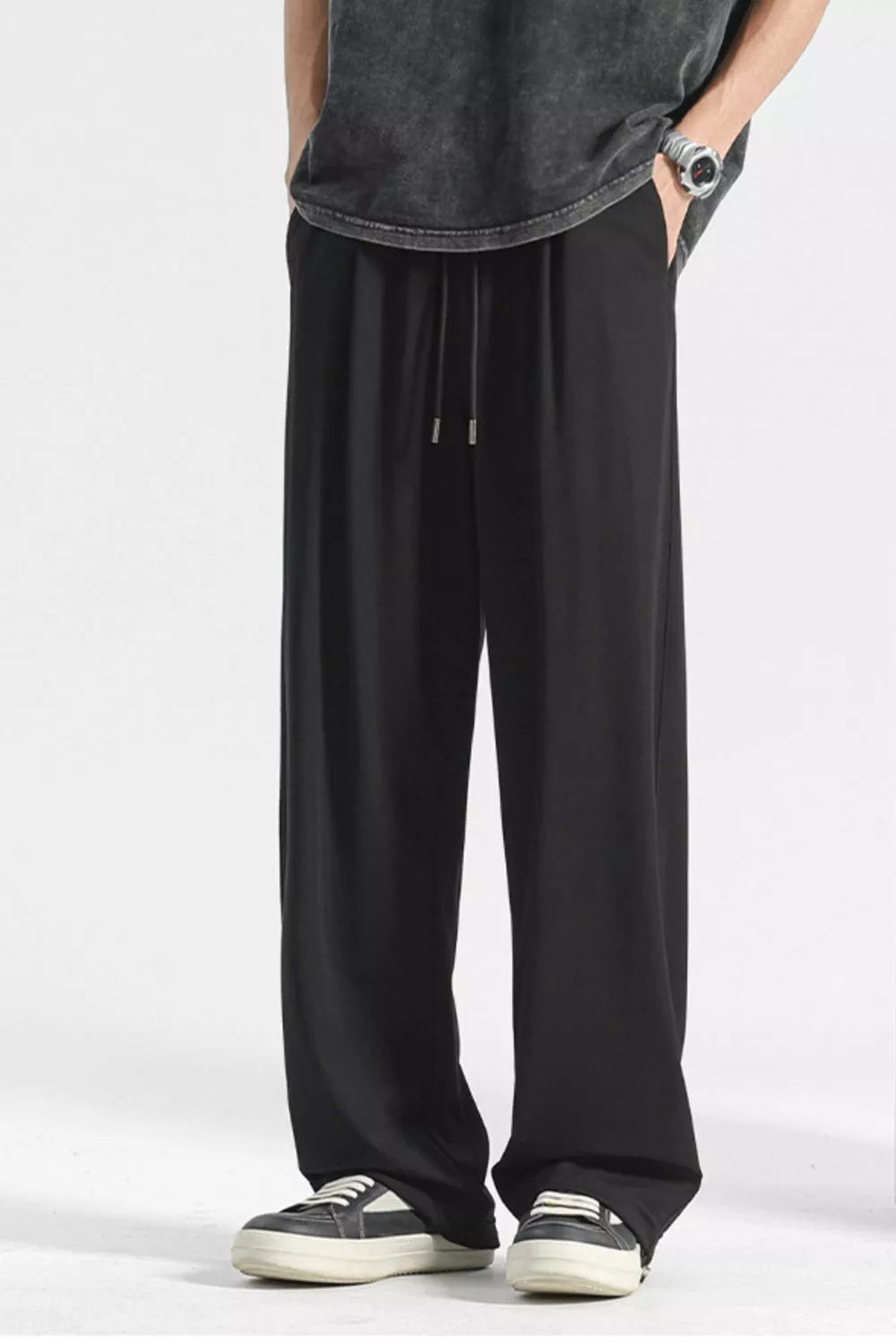Black sweatpants with drawstring waist and wide leg