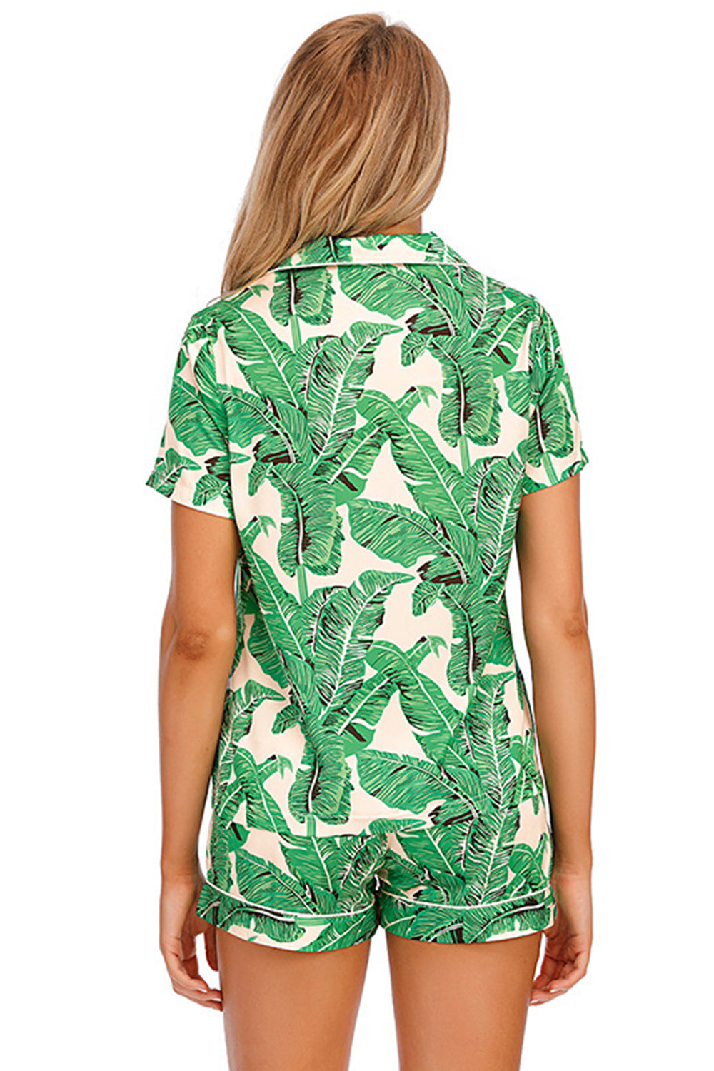 Green botanical print satin pajama set with buttoned top and shorts.