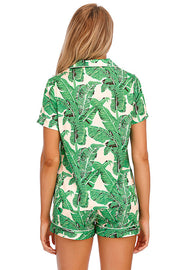 Green botanical print satin pajama set with buttoned top and shorts.
