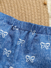 Blue cotton cami and shorts set with white bow print and elastic waistband.