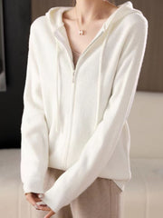 White ribbed knit zip-through hoodie with drawstring hood and silver zipper.