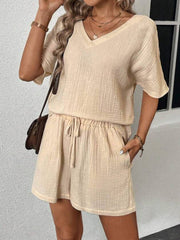 Textured gauze lounge set in tan, featuring a V-neck top and drawstring shorts.