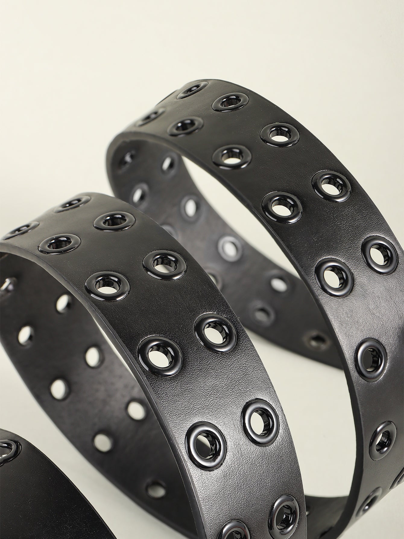 Black vegan leather belt with double grommet detail