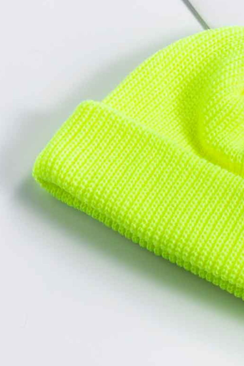 Ribbed knit beanie in bright yellow with a turn-up cuff.