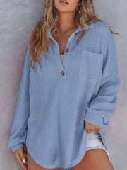 Blue waffle-knit Henley tee with button front, collar, and chest pocket.