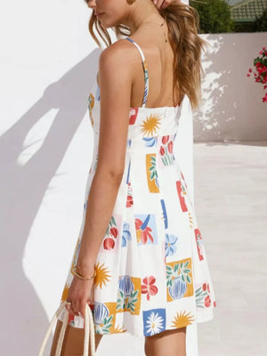 Vibrant floral print mini dress with tie-front detail, A-line cut, and spaghetti straps.