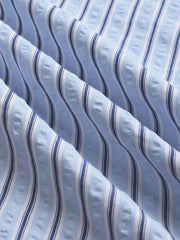 Maternity pants with blue and white vertical stripes and textured fabric detail.