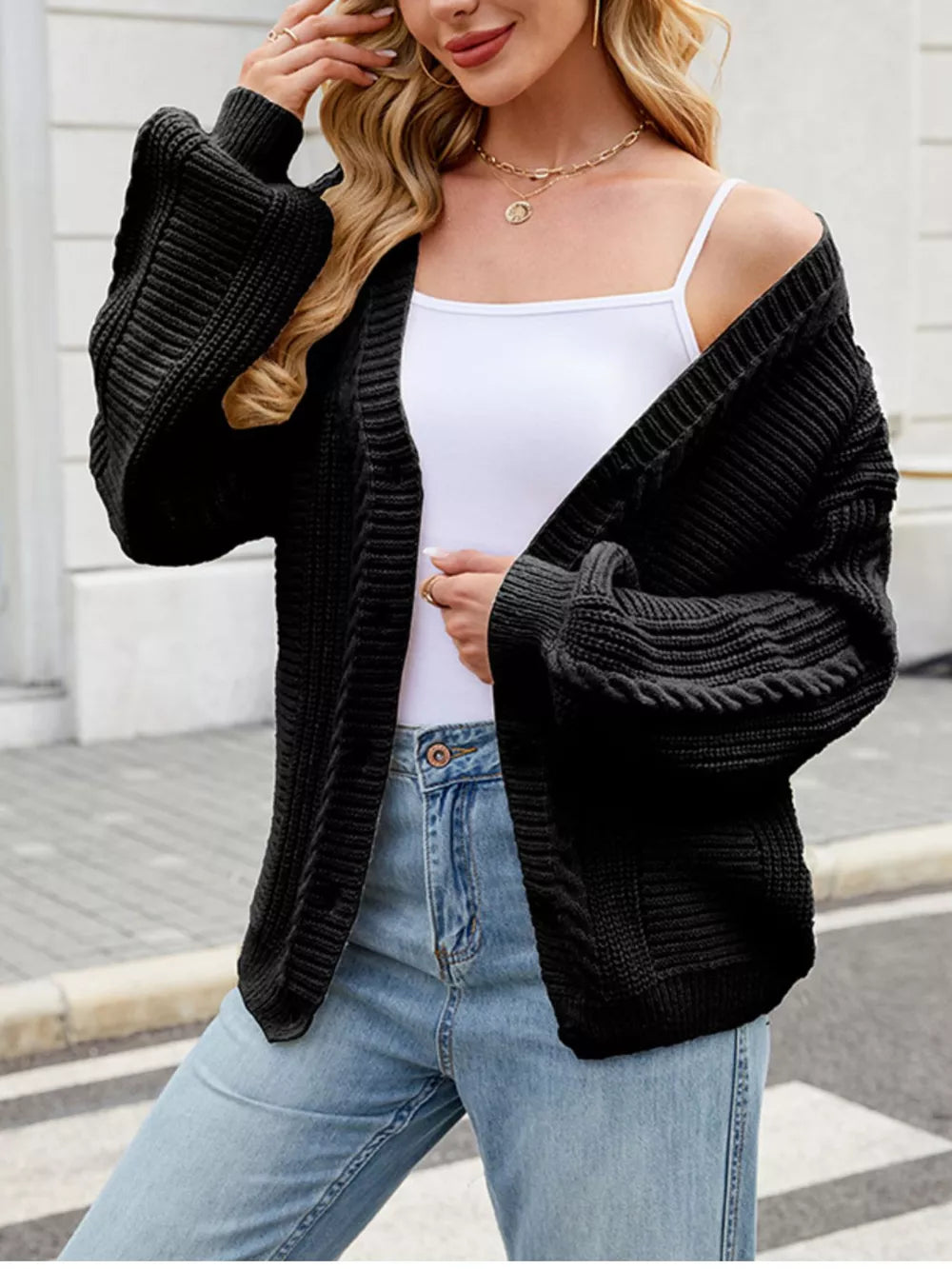 Cable Knit Button-up Cardigan in Black, editorial view