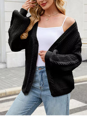Cable Knit Button-up Cardigan in Black, editorial view