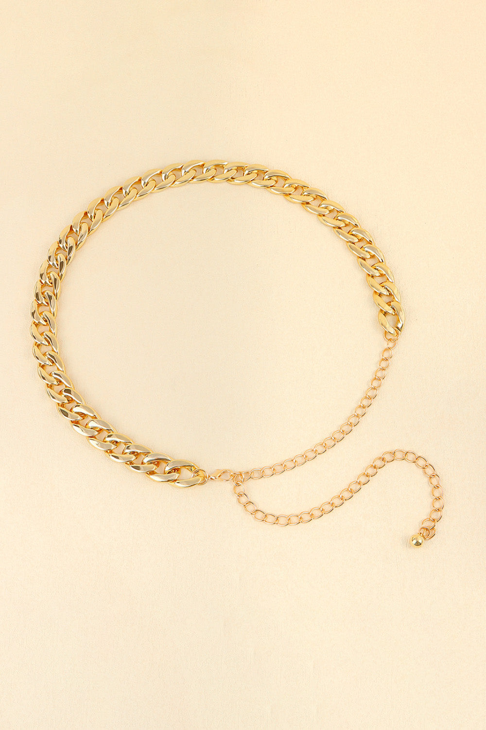 Gold chunky curb chain belt with adjustable extender chain and ball end.