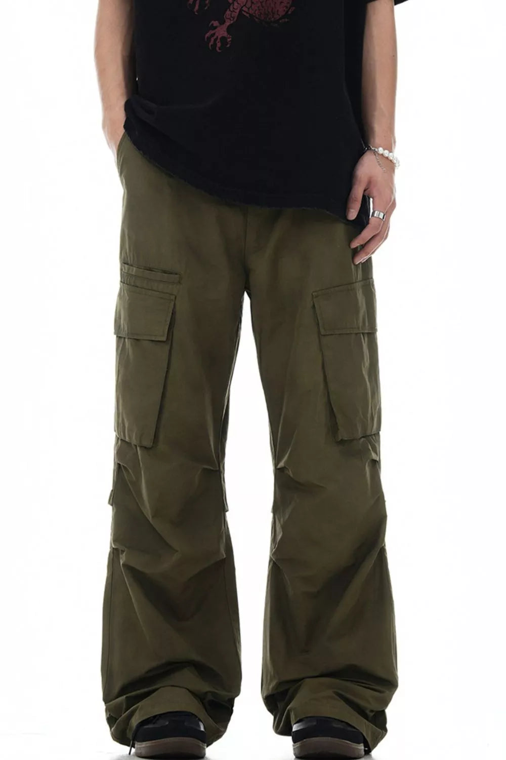 Olive green relaxed fit cargo pants with multiple pockets and a casual style.