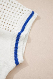 White eyelet knit sweater with blue striped cap sleeves.