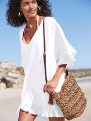 White ruffled V-neck beach cover-up with breezy bell sleeves and hem.