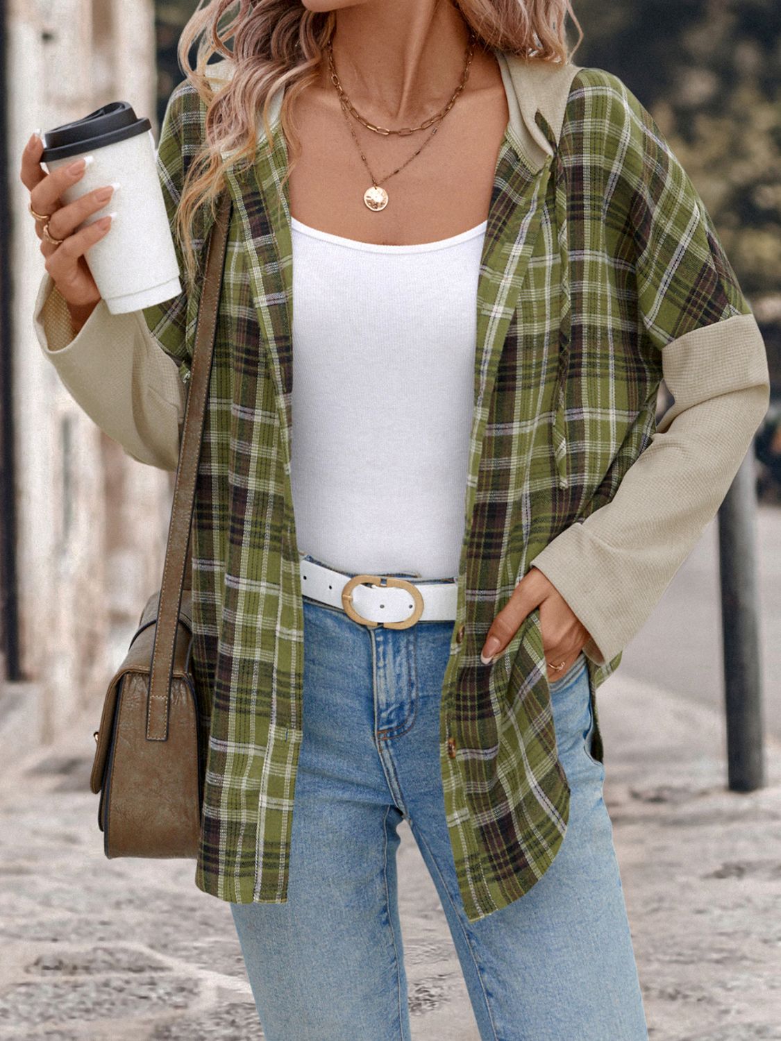 Colorblock plaid hooded shirt jacket in matcha green with contrasting sleeves and a button front.