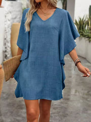 Blue V-neck mini dress with flowy sleeves and a textured fabric.