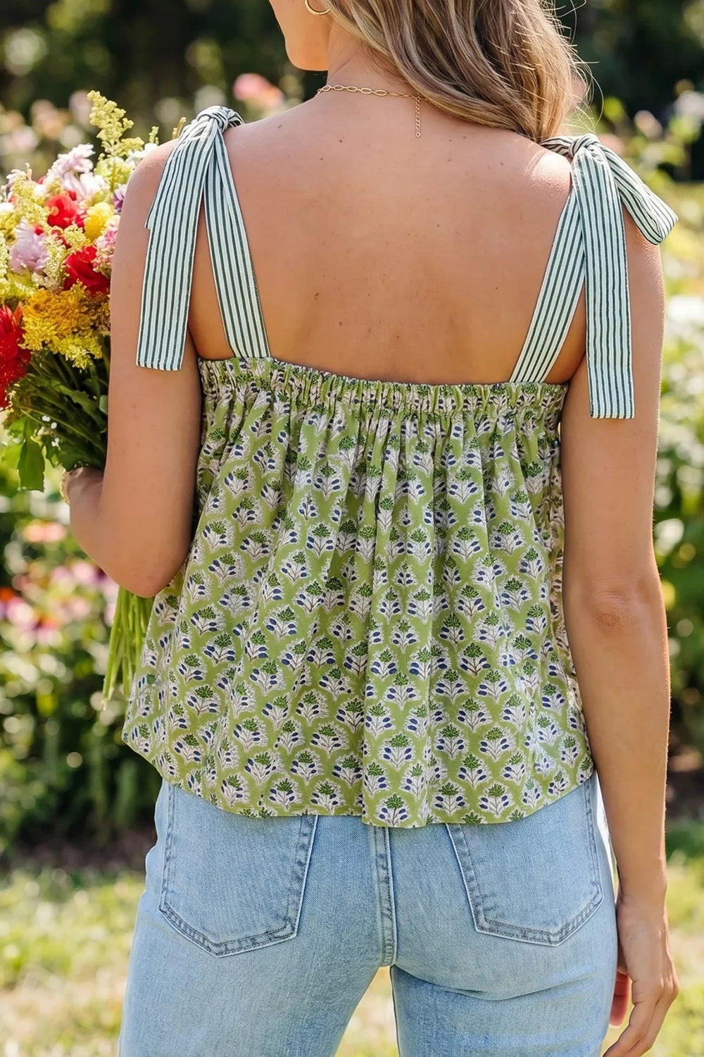 Floral tie-strap tank top with square neckline in green with blue print, cotton fabric.