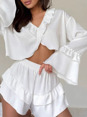 White ruffled V-neck pajama set with shorts and bell sleeves.