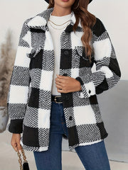 Oversized black and white checkerboard sherpa shacket with button front and chest pockets.