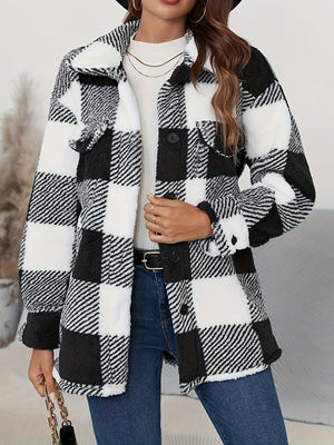 Oversized black and white checkerboard sherpa shacket with button front and chest pockets.