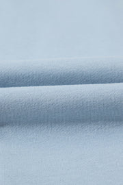Light blue quarter-zip sweatshirt fabric detail