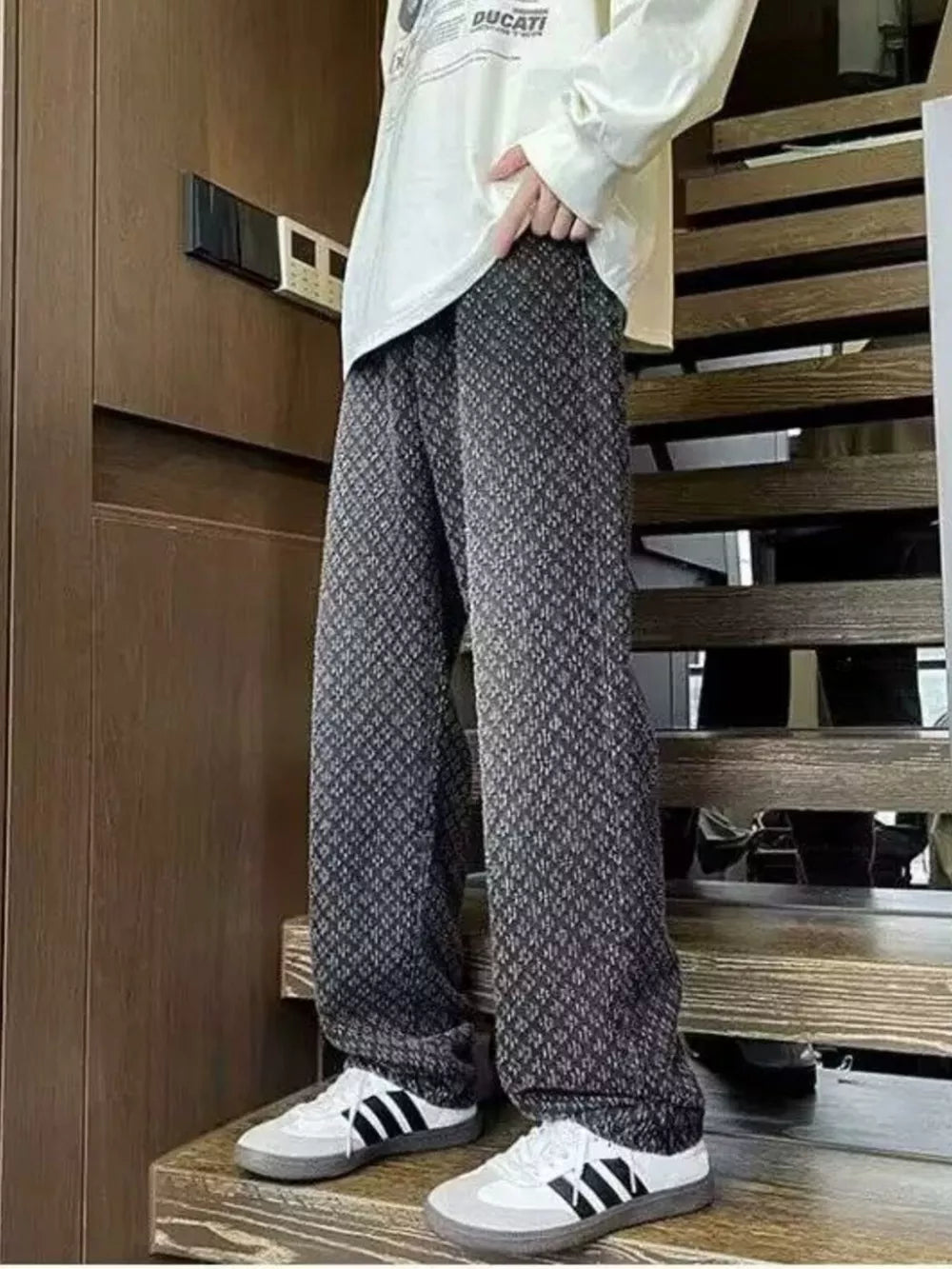 Black geometric print relaxed wide-leg jeans with a casual, chic style.