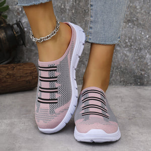 Pink and gray knit slip-on sneakers with black stripe detail and white soles.