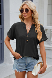 Textured black henley tee with rolled sleeves and button detail