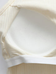 Cream ribbed racerback crop top with built-in bra detail