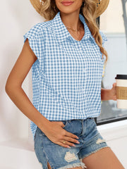 Sky blue gingham cotton shirt with cap sleeves and button-down front.