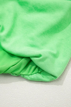 Green cotton drawstring outfit set detail showing ruching