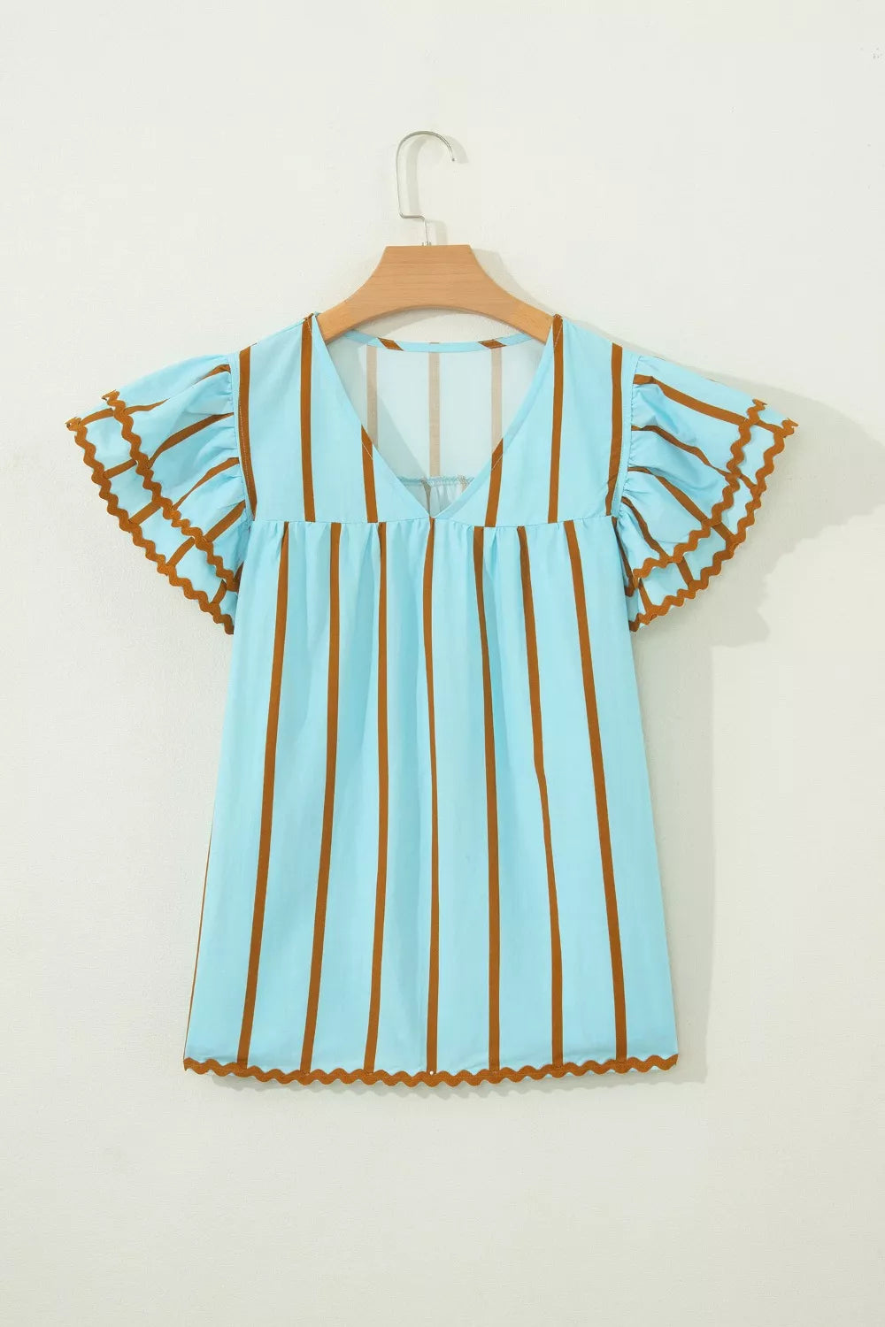 Light blue cotton blend blouse with brown vertical stripes, V-neck, and ruffled flutter sleeves with scalloped trim.