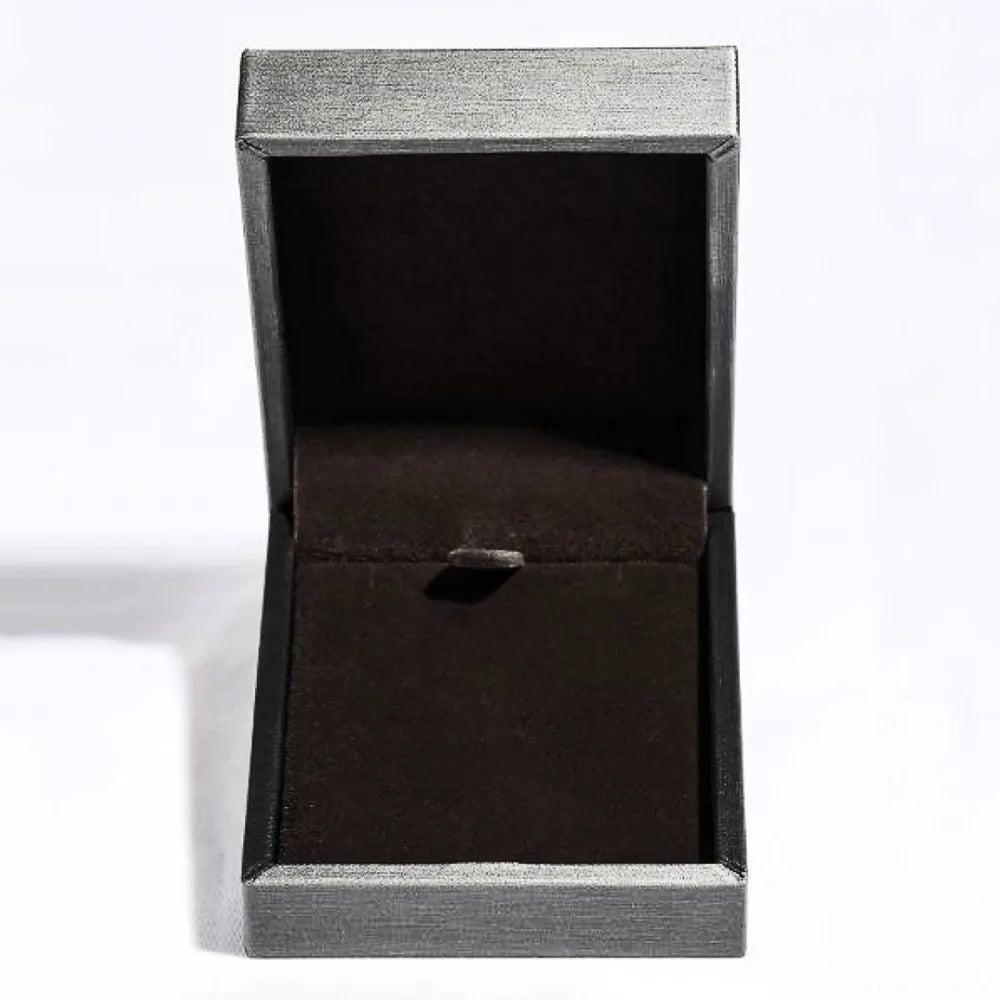 Open jewelry box with dark interior and textured silver exterior