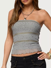 Gray strapless tank top with allover rhinestone embellishments and scalloped hem.