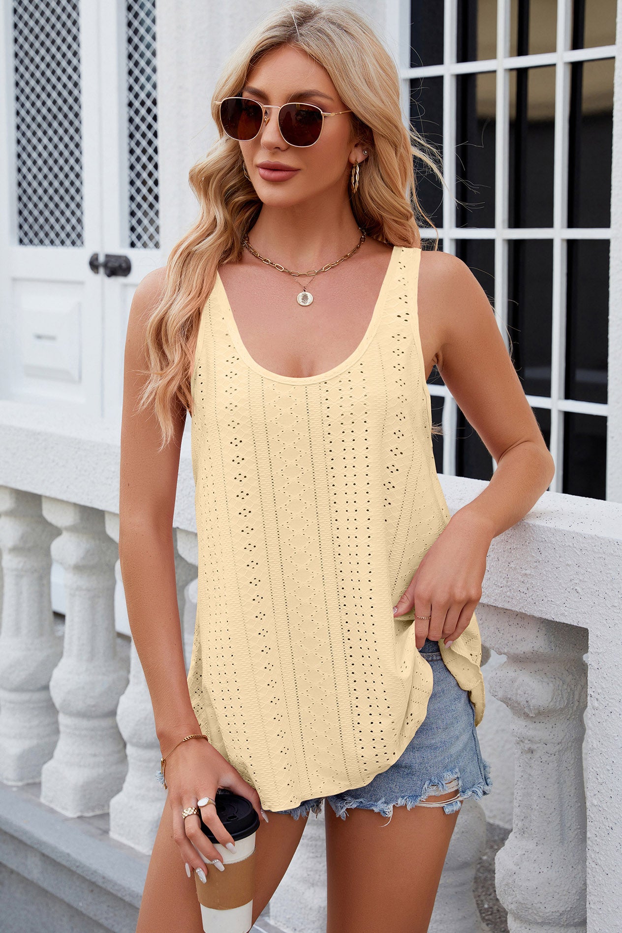 Light Yellow eyelet scoop neck tank top with breathable knit fabric.