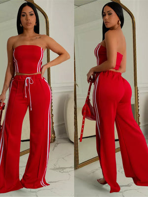 Red tube top and wide-leg pants set with white side stripes and drawstring waist.