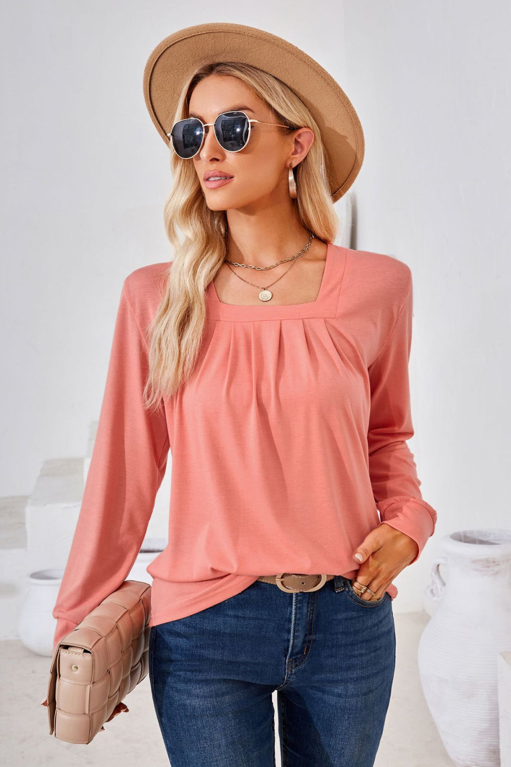 Burnt Coral jersey top with gathered square neckline and long sleeves.