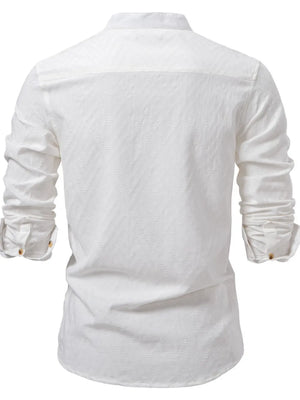 White geo-embossed henley shirt with mandarin collar and buttoned cuffs.