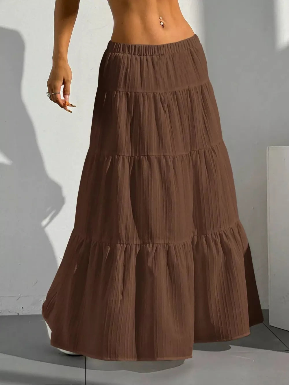 Brown tiered maxi skirt with elastic waistband and vertical texture