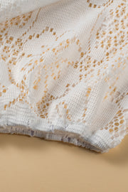 White lace peplum blouse with scalloped hem detail