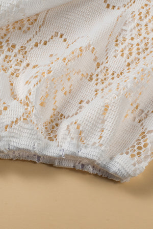 White lace peplum blouse with scalloped hem detail