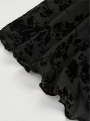 Black lace mini dress with velvet floral pattern and ruffled hem detail.