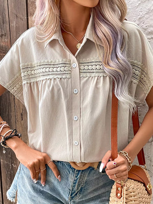Apricot lace-trimmed button-up shirt with classic collar and short sleeves.
