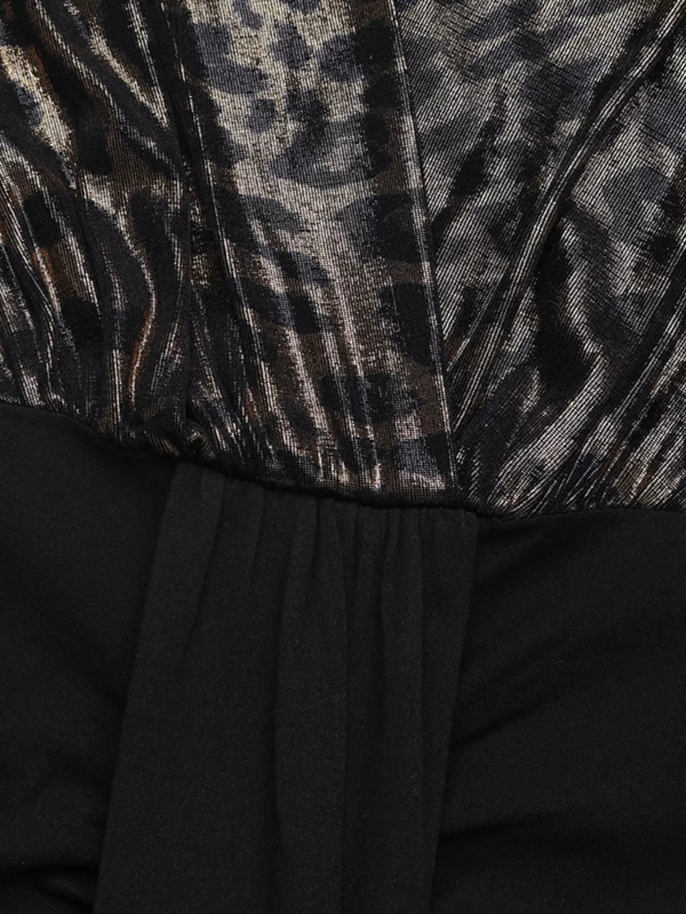 Black ruched long-sleeve dress with metallic animal print bodice and slit detail.