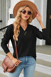 Black textured cable-knit henley pullover with V-neck and button detail