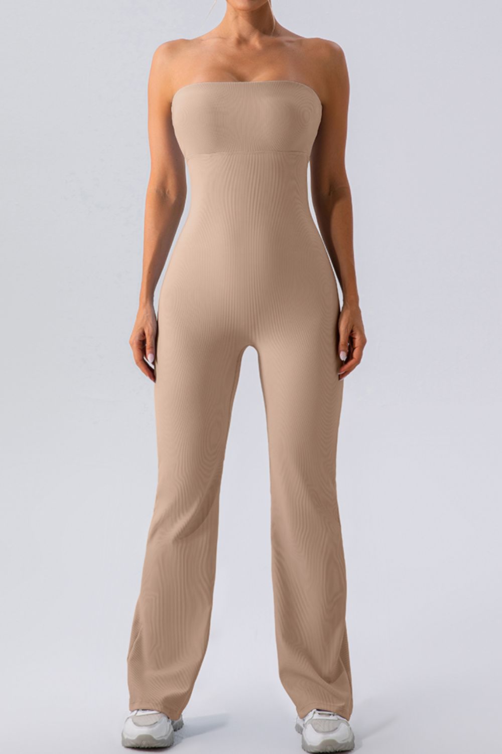 Camel ribbed bandeau flare leg jumpsuit with a seamless fit.