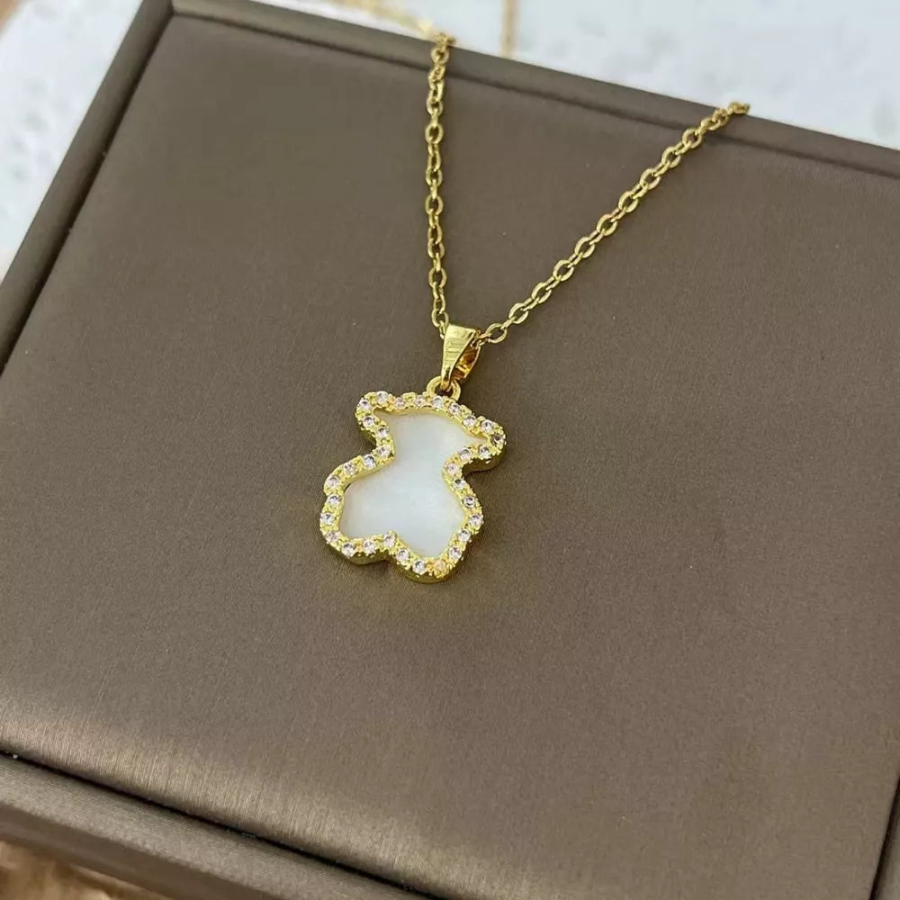 Gold-plated necklace with ivory bear pendant and crystal accents