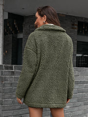 Green asymmetrical teddy moto jacket with a collared neckline and plush texture.