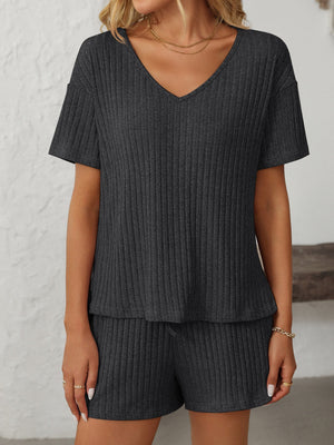 Black ribbed V-neck loungewear set with short sleeves and drawstring shorts.