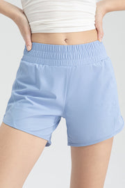 Light blue layered performance running shorts with elastic waistband